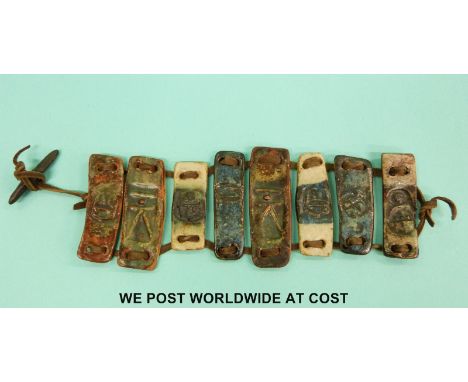 A studio pottery bracelet bracelet in the form of eight Troika style ceramic panels. 