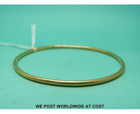 A 9ct gold bangle (12.35g) 