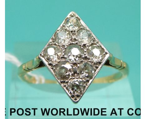 An 18ct gold ring set with nine old cut diamonds in a diamond shaped setting (size U)