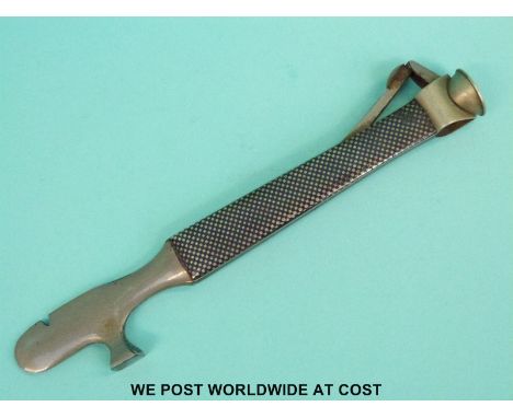 A niello white metal smoker's compendium tool comprising cigar cutter, bowl clearer and pipe tamper, stamped 935 sterling and