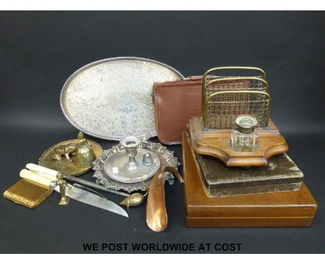 A collection of cased plated cutlery, desk tidy and inkwell, Elkington chamber stick etc