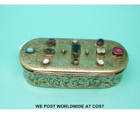 A Victorian hallmarked silver lidded box, Birmingham 1852, with engraved foliate design, set with various gemstones including