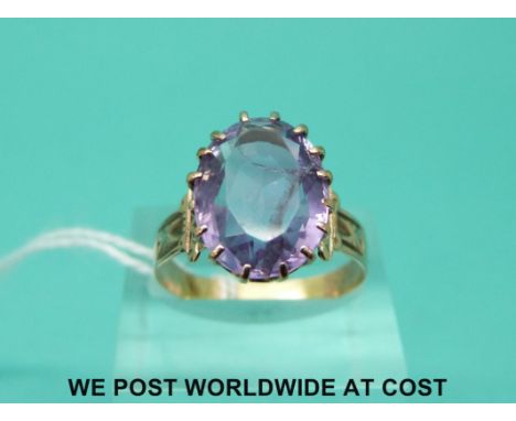 A Victorian yellow metal ring set with a large amethyst (size R)