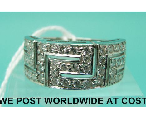 An 18ct white gold ring set with diamonds in Greek Key design (size P)