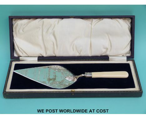 A cased hallmarked silver presentation trowel engarved "Presented to Mr W T Entwisle at the stone laying of the Ansdell Bapti