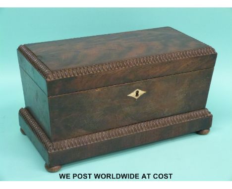 A 19thC mahogany sarcophagus shaped tea caddy with ivory inlay, raised on bun feet (W31xD16xH17cm)