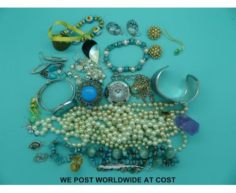 A quantity of costume jewellery to include faux pearls, Swarovski model of an egg timer, a cicada and a quantity of silver an