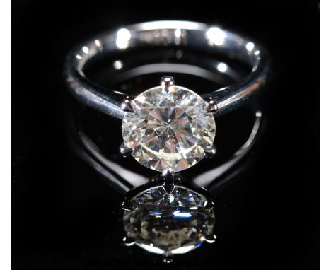 A platinum ring set with a modern round brilliant cut diamond of approximately 2.38ct (size N)