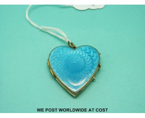 A large Victorian yellow metal locket in the form of a heart, set with aqua blue guilloche enamel 