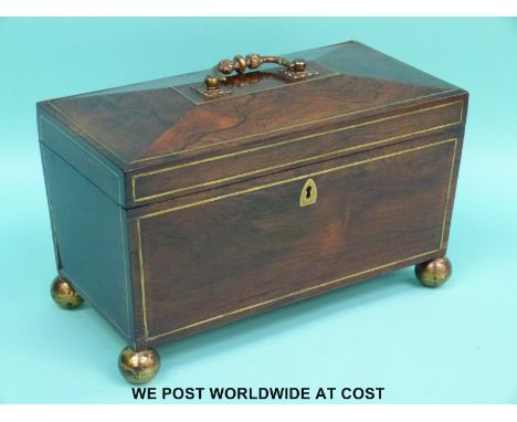 A William IV rosewood and brass inlaid tea caddy with two covered compartments flanking a glass mixing bowl (W30.5xD16xH20.5c