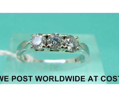 An 18ct white gold ring set with three diamonds, total diamond weight approximately 0.75ct (size K) 