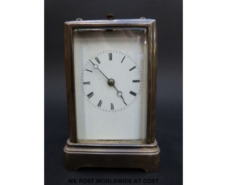 A late 19thC carriage clock with repeating mechanism striking on a bell, in silver plated case with five bevelled glass panel