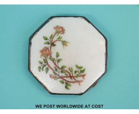 An Art Deco guilloche enamel hallmarked silver compact of octagonal shape, the enamel having engine turned background with fo