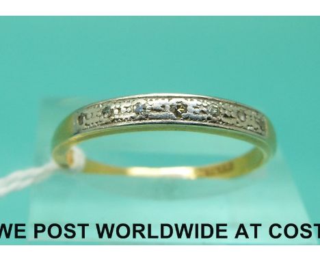 An 18ct gold ring set with diamonds in a platinum setting (size Q)