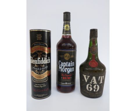 A boxed half bottle of Glenfiddich malt whisky, Captain Morgan rum, 1 litre, and a bottle of Vat 69