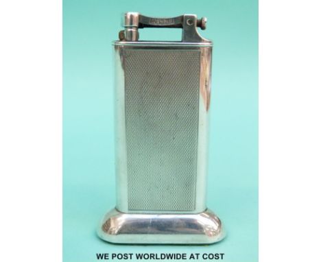 A Dunhill silver plated table lighter with engine turned decoration, height 10cm