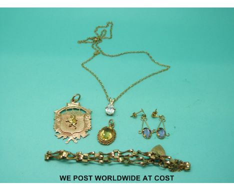 A collection of 9ct gold jewellery including chain, fob, bracelet, citrine set fob and a pair of earrings set with amethyst (
