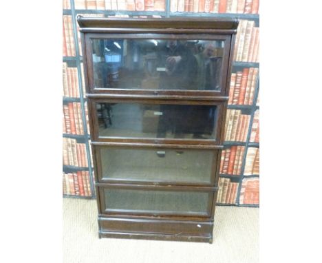 An oak glazed Globe Wernicke four tier bookcase with ivorine plaque to each section (H152 x W87 x D31cm) 