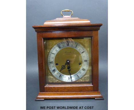 A Comitti London three train mantel clock in 'bell top' style case