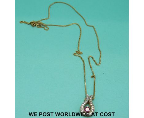 A 9ct gold pendant set with a ruby on 9ct gold chain