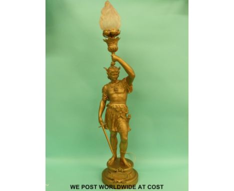 A large gilt spelter light fitting or lamp in the form of Thesee a Roman gladiator with pink glass shade (105cm tall)