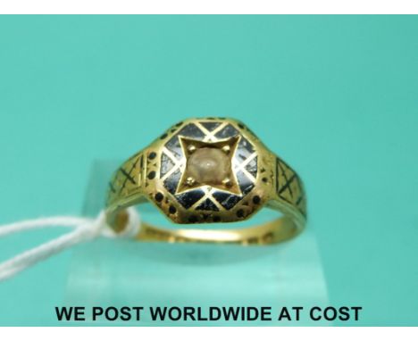 A Victorian 15ct gold ring decorated with enamel