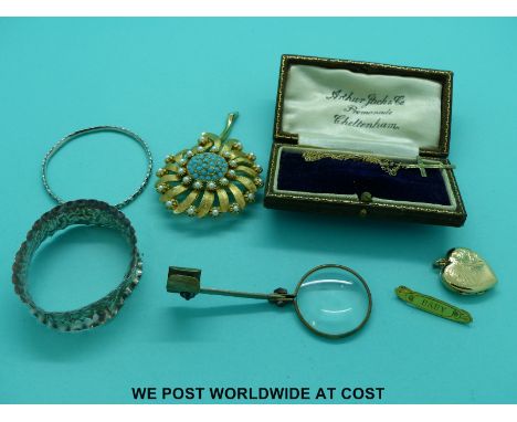 A silver napkin ring, silver christening bangle, 9ct gold cross and chain, Cheltenham jewellery box etc