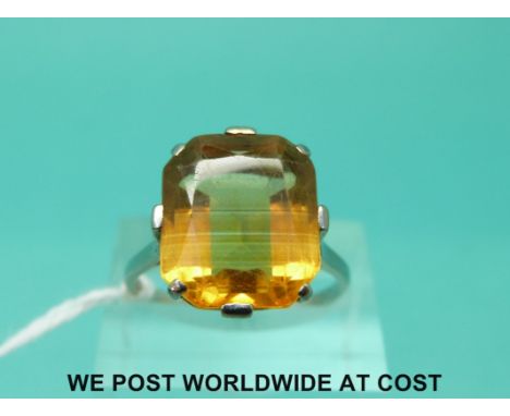 A white metal ring set with a large citrine and diamonds to the shoulders (size R)