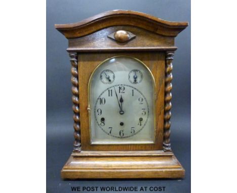 An oak cased mantel clock with three train movement by Kienzle no 113909, the Westminster chime with strike silent facility o