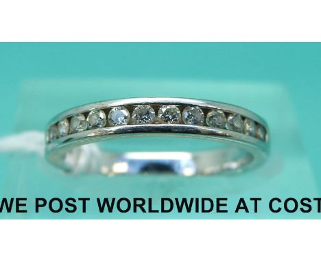 An 18ct gold half eternity ring set with diamonds (size H)