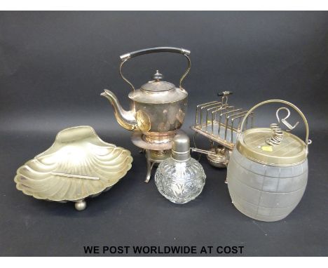 An Asprey of London heated toast rack together with a plated spirit kettle, a large dish in the form of a scallop shell, a bi