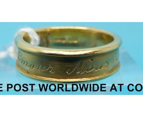 An 18ct gold ring by Laura Lee with French script 'Amour Nous Unité' or 'Love Unites Us', (6.5g, size K) 