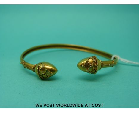 A c1880 Victorian yellow metal child's bangle in the Etruscan style