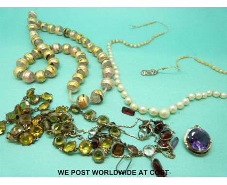 A collection of jewellery including a 9ct gold pendant set with an amethyst, graduated pearl necklace with 9ct gold and diamo