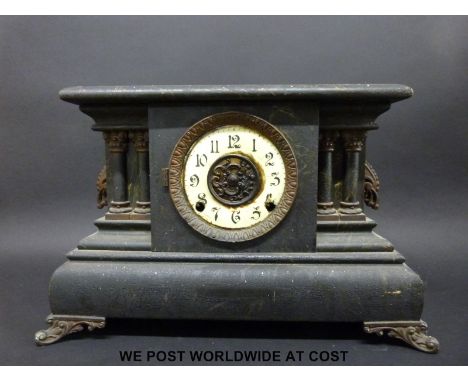 A wooden cased faux slate / marble two-train mantel clock, striking on a gong, with alarm attachment and the face with Arabic