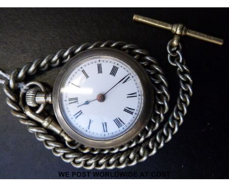 French white metal pocket watch with black Roman numerals and white enamel dial, on graduated chain, case diameter 40mm