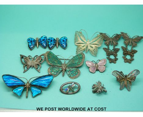 Eight silver butterfly brooches including three set with butterfly wing, two set with enamel, a silver and enamel dragonfly b