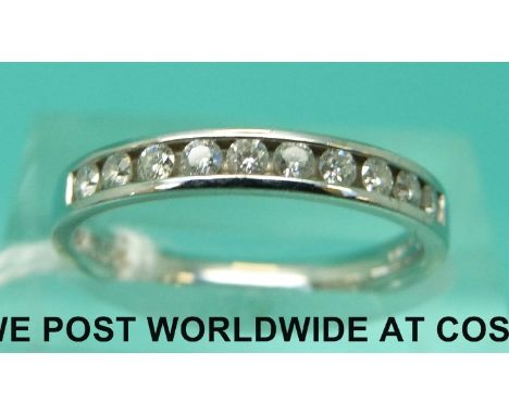 A platinum half eternity ring set with diamonds (size K/L)
