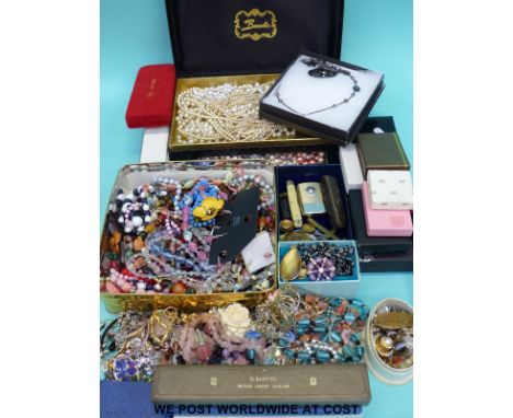 A large quantity of costume jewellery to include necklaces, earrings and brooches together with a Ronson lighter, pen knife e