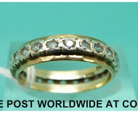 A 9ct gold eternity ring set with clear stones (size M)