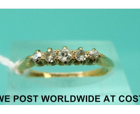 An 18ct gold ring set with five old cut diamonds (size M)