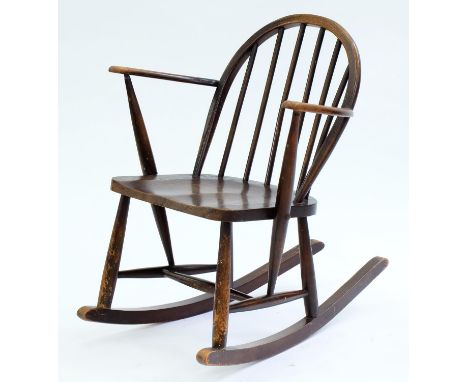 AN ERCOL F182 ELM ROCKING CHAIR, C1960 Condition report  &nbsp;Rubbed, scuffed and scratched in places consistent with age an