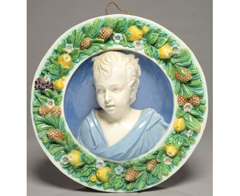 A CANTAGALLI ROUNDEL OF THE HEAD OF A BOY IN THE MANNER OF DELLA ROBBIA, LATE 19TH C, OF TERRACOTTA IN WHITE SLIP AND COLOURE