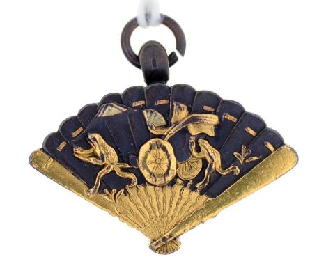 A JAPANESE SHIBUICHI AND GOLD FAN SHAPED FOB PENDANT, THE BACK INSET WITH A COMPASS, MEIJI PERIOD, 23MM L Condition report  &