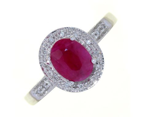 A RUBY AND DIAMOND CLUSTER RING, IN WHITE GOLD WITH PIERCED SHOULDERS, MARKED 14K, 4.1G, SIZE M Condition report  &nbsp;Good 