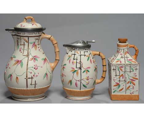 TWO AESTHETIC BROWNHILLS POTTERY CO PEWTER MOUNTED EARTHENWARE JUGS AND A FLASK, C1890, WITH BAMBOO FORM HANDLE AND MOULDED W