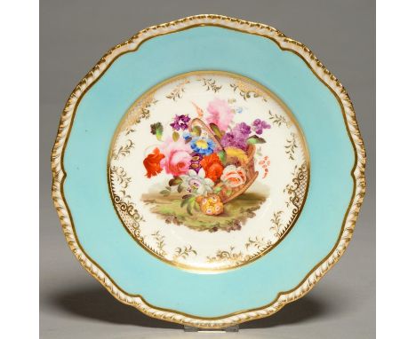 A COALPORT PLATE, C1820, PAINTED WITH AN UPTURNED BASKET OF FLOWERS IN GILT CAVETTO AND LIGHT BLUE BORDER, SHAPED GILT GADROO