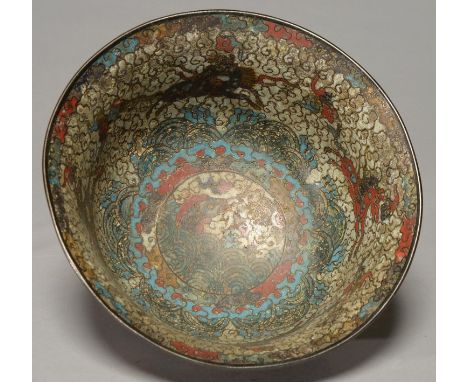 A CHINESE CLOISONNE ENAMEL BOWL, 19TH C, THE ROUNDED SIDES WITH GENTLY EVERTED RIM, DECORATED WITH QILIN AND FLOWERING PLANTS