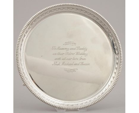 AN ELIZABETH II SILVER WAITER WITH EMBOSSED HUSK BORDER, ON THREE CLAW AND BALL FEET, 15CM DIAM, BY J. DIXON & SONS LTD., SHE