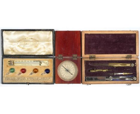 A SET OF SPIRIT SAFETY TESTERS, LATE 19TH C, COMPRISING FOUR GLASS AMPOULES OF RED, GREEN, AMBER OR BLUE LIQUID, AN IVORY THE